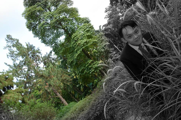 A weird shot of the groom in the grass was among the wedding pics. Photo / Jaclyn Ying/Facebook